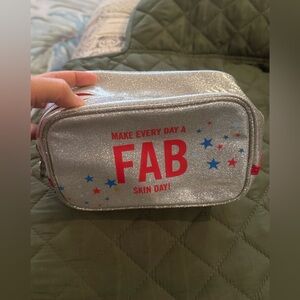 First Aid Beauty Cosmetic Bag Silver Glitter Makeup Bag with Red and Blue Stars
